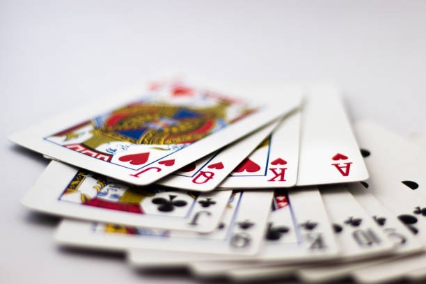 Spadegaming dealer at blackjack table Dealer in professional attire at blackjack table